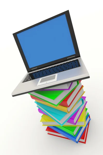 Laptop på trave böcker — Stockfoto