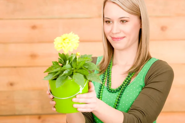 Portrait happy woman hold yellow flower spring — Stock Photo, Image