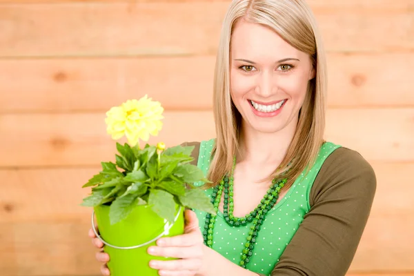 Portrait happy woman hold yellow flower spring — Stock Photo, Image