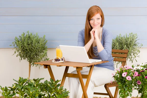 Summer terrace redhead woman with laptop — Stock Photo, Image