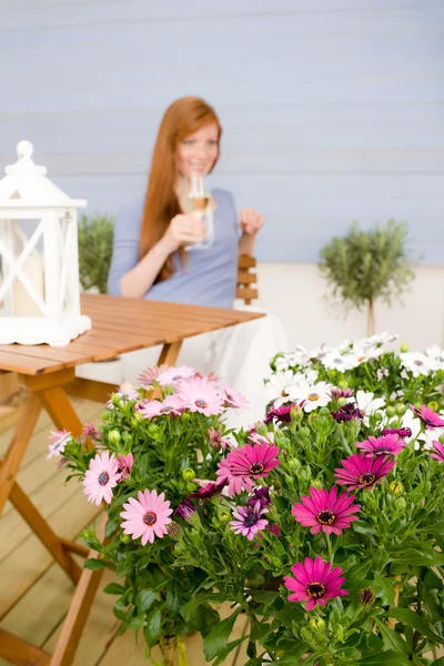 Summer terrace redhead woman hold glass of wine — Stock Photo, Image