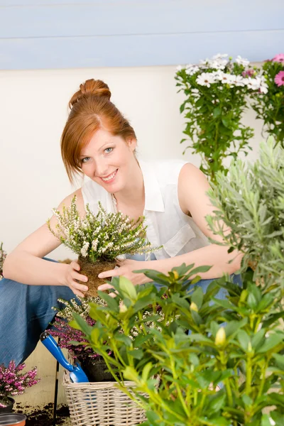 Summer garden terrace redhead woman hold flower — Stock Photo, Image