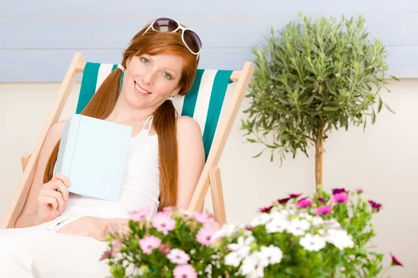 Summer terrace red hair woman relax in deckchair — Stock Photo, Image