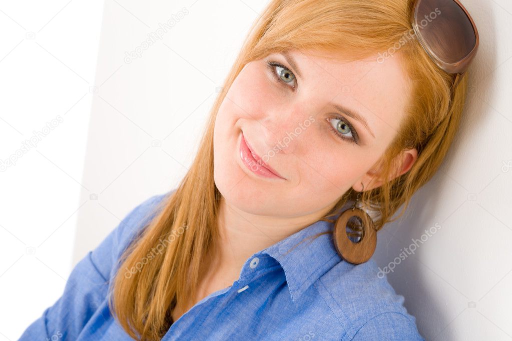 Portrait of young happy woman in designer clothes