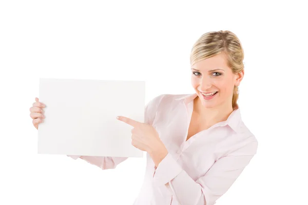 Businesswoman pointing aside at white banner — Stock Photo, Image