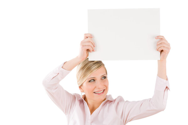 Happy businesswoman holding up empty banner