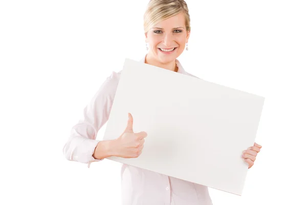 Happy businesswoman behind empty banner thumbs up — Stock Photo, Image
