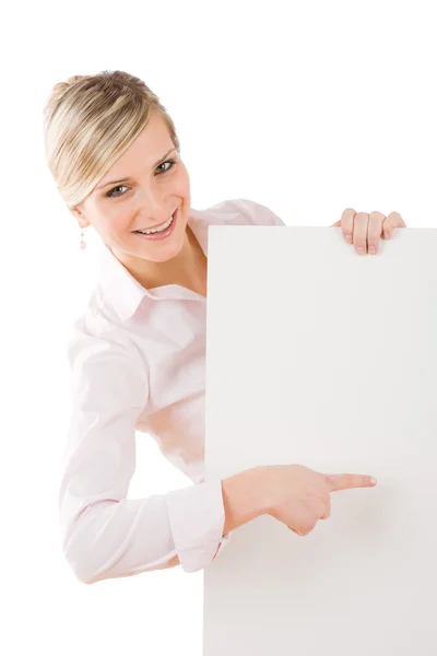 Businesswoman pointing aside at empty banner — Stock Photo, Image