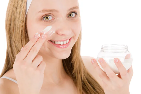 Facial care teenager woman apply cream — Stock Photo, Image