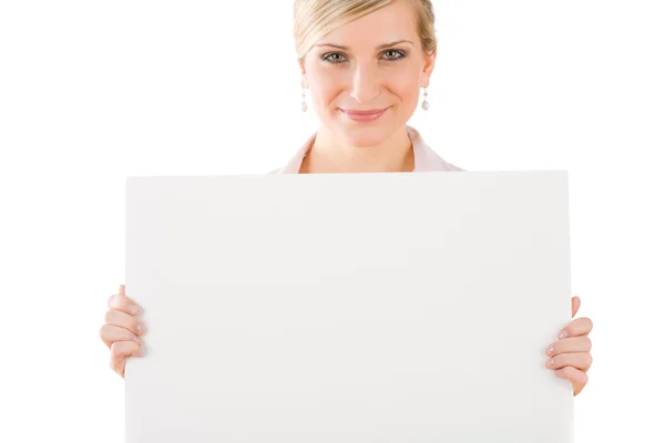 Businesswoman hold empty banner in front Stock Picture
