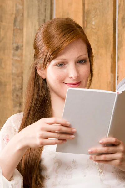 Young romantic woman in barn reading book — Stock Photo, Image