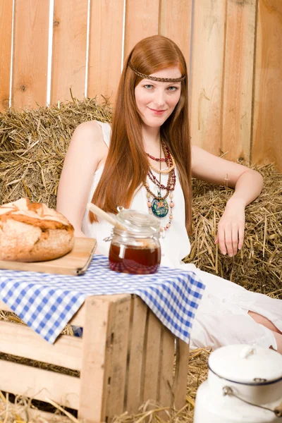 stock image Redhead hippie woman have breakfast in barn