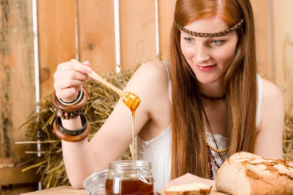 Red-hair young hippie woman have breakfast in barn — Stock Photo, Image
