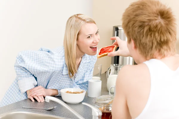 Breakfast happy couple man feed woman toast — Stock Photo, Image