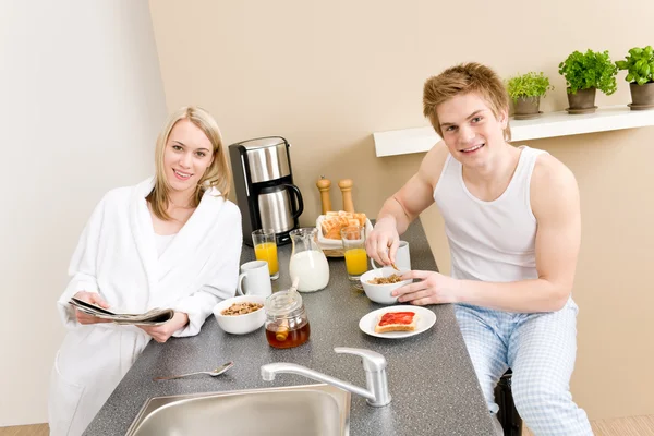 Breakfast happy couple eat cereal drink coffee — Stock Photo, Image