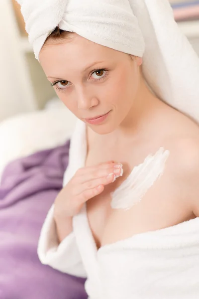 Young student girl apply body cream lotion — Stock Photo, Image