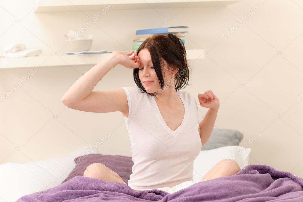 Attractive student girl wake up at home
