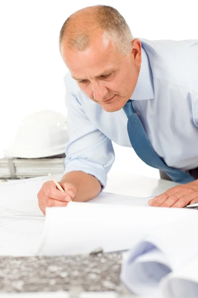 Senior man work on blueprints construction plans — Stock Photo, Image