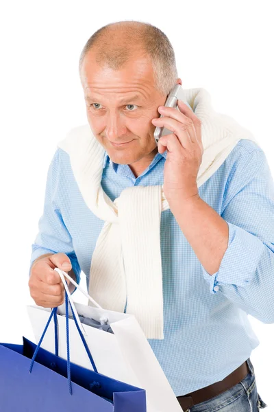 Starszy człowiek szczęśliwy gospodarstwa torby na zakupy — Zdjęcie stockowe