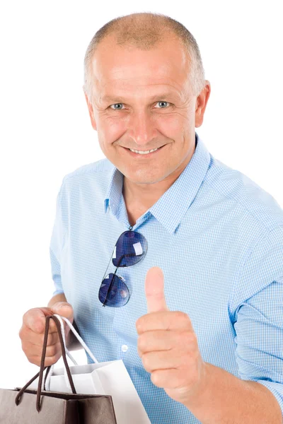 Senior gelukkig man winkelen duim omhoog — Stockfoto