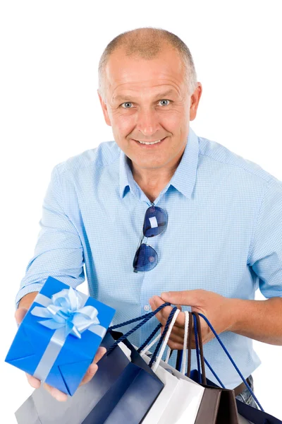 Érett smilling ember tartsa bevásárló táskák — Stock Fotó