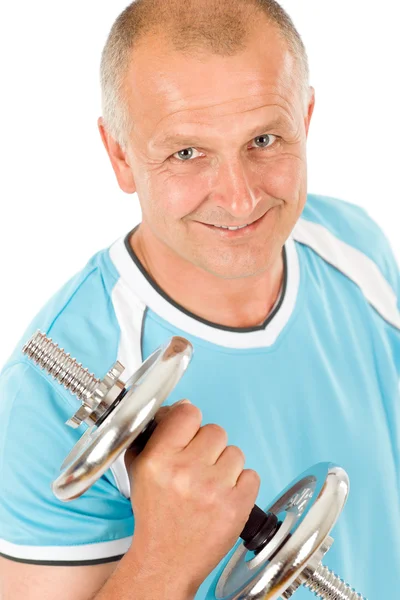 Happy mature man working out with dumbbells Royalty Free Stock Images