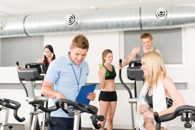 Young fitness instructor gym spinning clipart