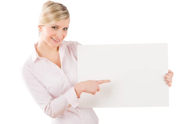 Бізнес-леді вказує осторонь на білий банер — стокове фото
