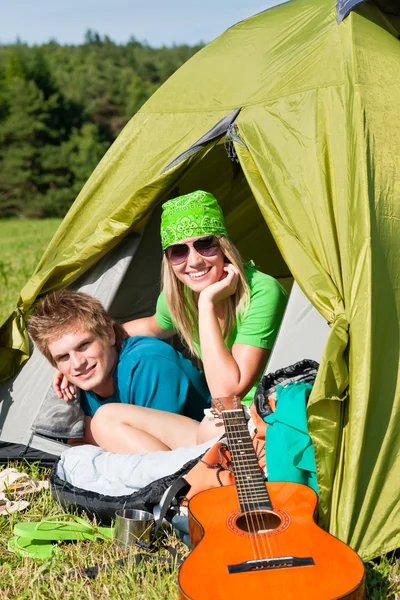 Camping couple lying inside tent summer countryside — Stock Photo, Image