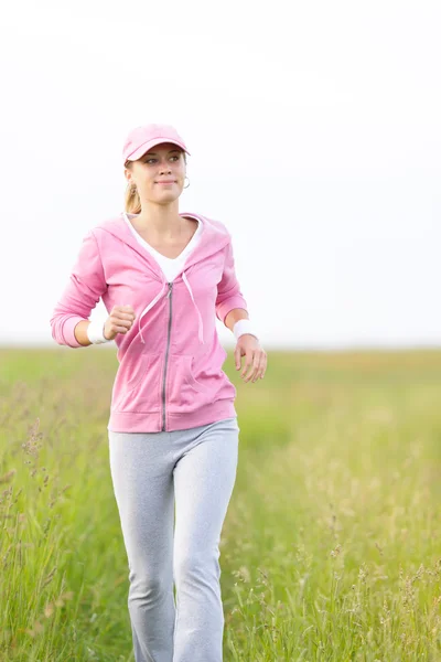 Jogging sportive young woman running park field — Stock Photo, Image