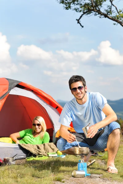 Camping young couple with tent cook countryside — Stock Photo, Image