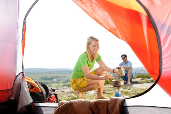 Camping young couple outside tent cook meal — Stock Photo, Image