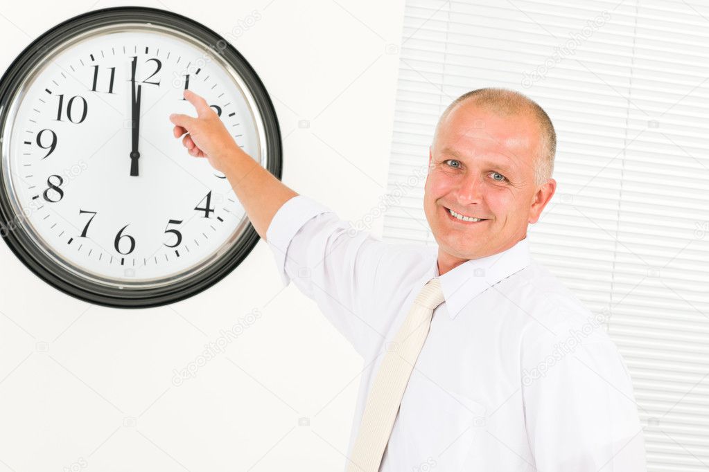 Punctual businessman mature point at clock — Stock Photo ...