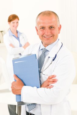 Medical doctor team senior male hold folders clipart