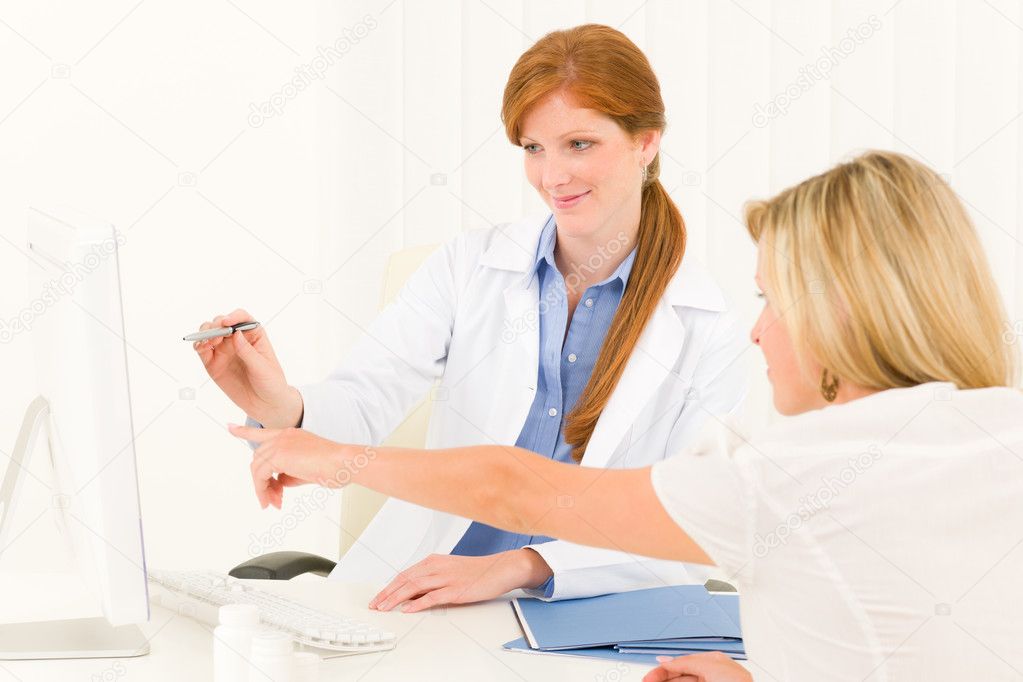 Female doctor consultation patient point computer