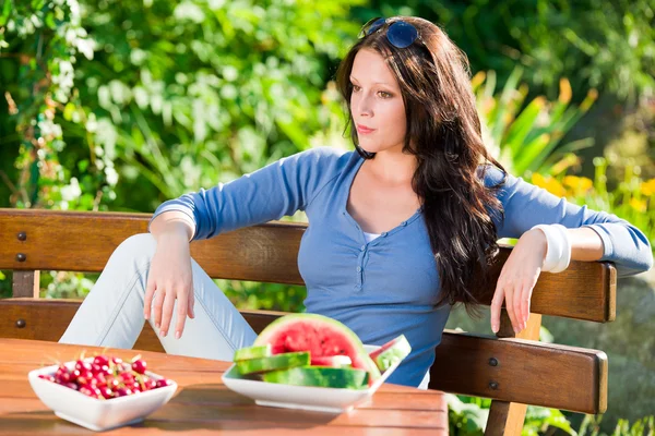 Garden terrace beautiful woman fresh summer fruit — Stock Photo, Image