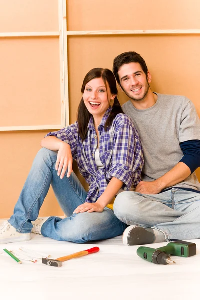 stock image Home improvement young couple relax on floor