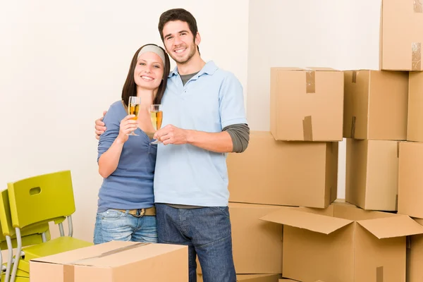 Moving into new home young couple toast — Stock Photo, Image