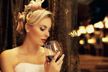 Beautiful woman drinking red wine clipart