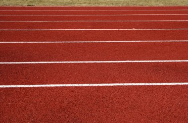 Asphalt for runners placed on local stadium clipart