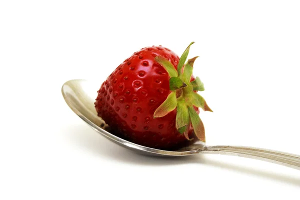 Zvětšeném foto jahodníku na lžíci — Stock fotografie