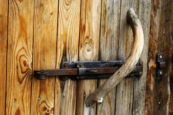Foto of doorknob on old wood door — Stock Photo, Image