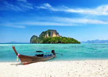 Long boat and poda island in Thailand clipart