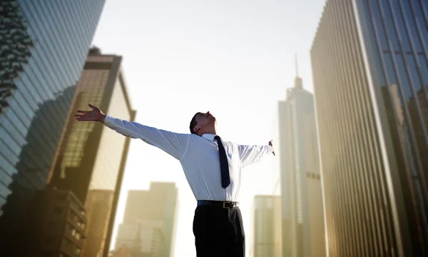 Happy young businessman and big city — Stock Photo, Image