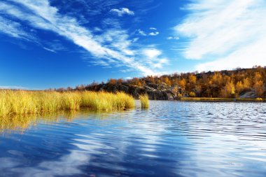 Mountain autumn lake in north of Russia clipart