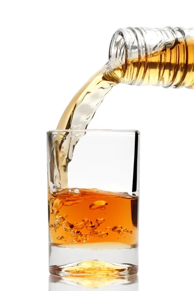 Whiskey being poured into a glass — Stock Photo, Image