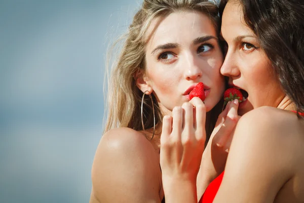 stock image Two sexy girls with strawberries