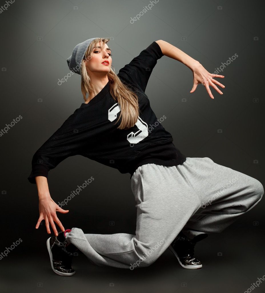 Hip-hop style dancer posing on isolated background Stock Photo by ©opolja  20048747