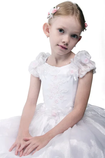 stock image The little girl in a white dress