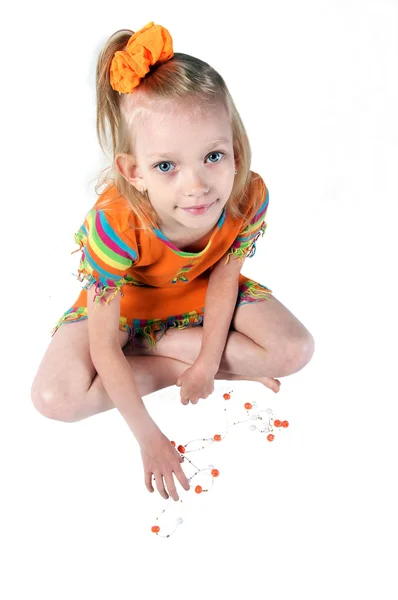 La niña con un vestido naranja Imagen De Stock